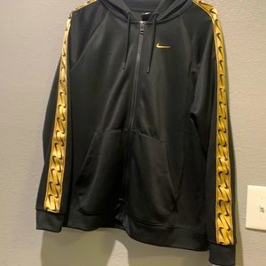 Golden Nike jacket in good condition